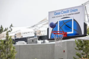 Basketball about to enter the hoop on the Gesa Credit Union-sponsored High School Elite Center Court at Spokane Hoopfest.